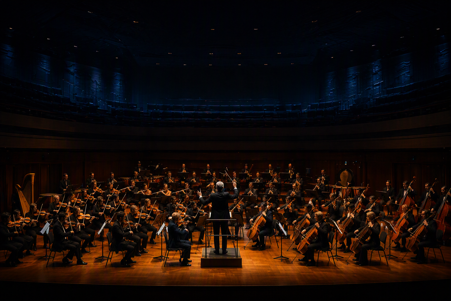 A symphony orchestra performing under warm stage lighting viewed from above, representing BitLOGIC's AI and automation services orchestrating seamless business workflows.